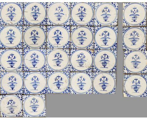 Lot of 26 19th century blue flower pot tiles. Circa 1850. Of which 22 intact and four damaged. Dimensions: 13 x 13 cm. In rea