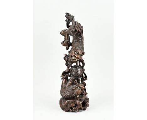 Antique Chinese hardwood carved figure with ball playing kylins. Detailed fur + glass eyes. Circa 1900. Size: H 46 cm. In goo
