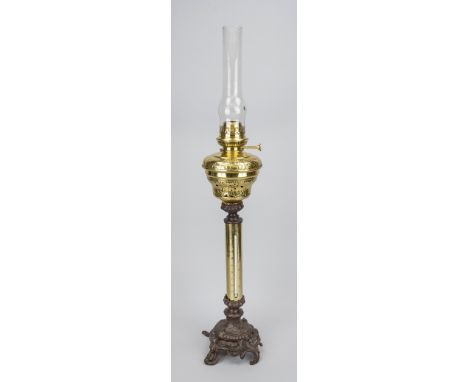 Antique brass oil lamp with thermometer and cast iron base. Circa 1900. Dimensions: H 85 cm. In good condition.