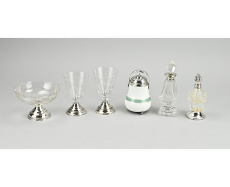 Six pieces with silver, 833/000 including a match pot with silver lid and bracket, engraved 1838, 12 cm. a small carafe with 