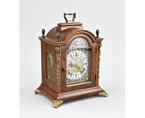 Walnut Warmink table clock with bronze decorations, moon phase + repetition striking mechanism. Dimensions: H 27 cm. In good 