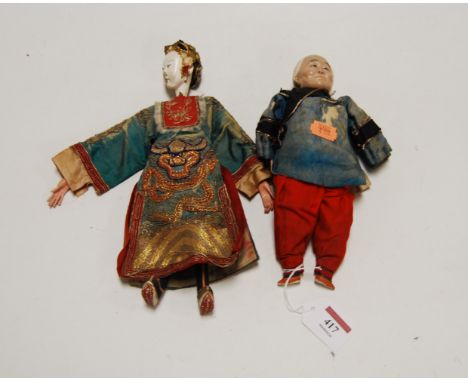 An early 20th century Chinese composition doll, in blue silk robe; together with another similar example (2)