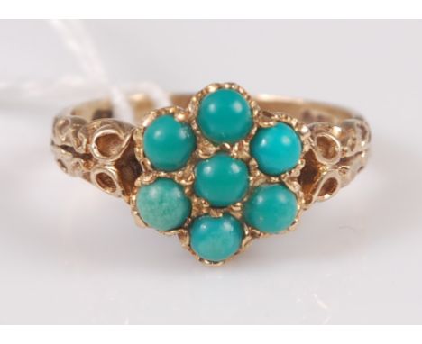 An early 20th century 9ct gold and turquoise set flower head cluster ring, with chased shoulders, 3g, size J/K