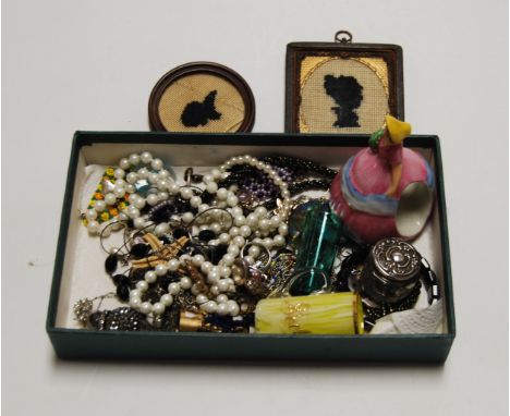 A small collection of miscellaneous items, to include an embroidered portrait silhouette, small green glass beaker, silver to
