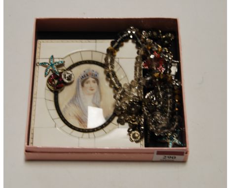 A small collection of costume jewellery, to include paste set hair clip, paste necklace etc, and a reproduction portrait mini