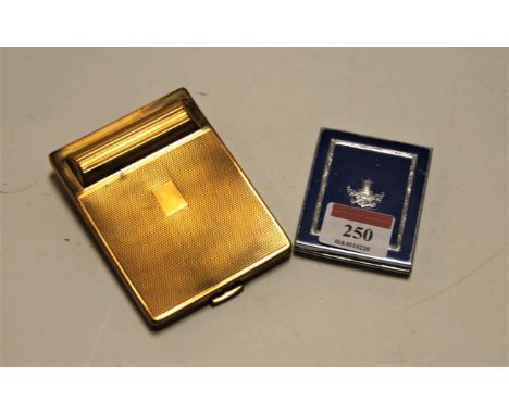 A ladies brass cased The Duplique powder compact, having engine turned decoration, together with one other ladies powder comp