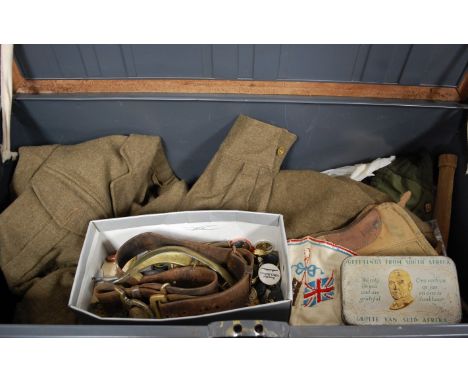 A military trunk initialled to the lid MH Bull, Royal Army Service Corps, contents to include WWI style trench club, various 