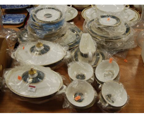 A Royal Doulton eight place setting dinner service in the Carlisle pattern H5018.With light cutlery marks throughout.Plates a