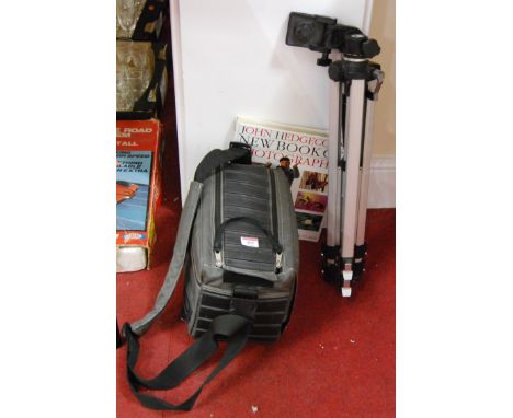 A collection of photography equipment, to include photography bag and contents, tripod and a New Book of Photography