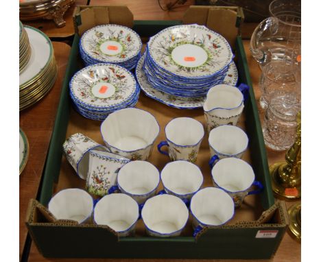 A Royal Stafford part tea service in the June pattern, enamel decorated with birds, butterflies, flowers and foliage