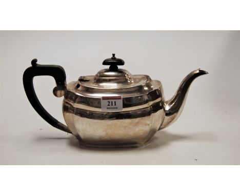 A George V silver teapot, of plain shaped rectangular form, having ebony finial and handle, 18.4oz