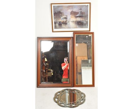 Two 20th century wall hanging mirrors. The mirrors of a rectangular form set in a wooden mahogany frame along with a picture 