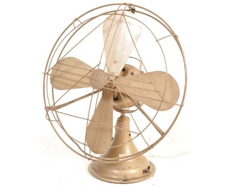 An early 20th century G.E.C. (General Electric Company) electric desk fan. The fan having a large four blades propeller to th