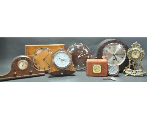 A collection of vintage 20th century mantel clocks comprising of an oak Metamec clock, an Art Deco style mantel clock, a bras