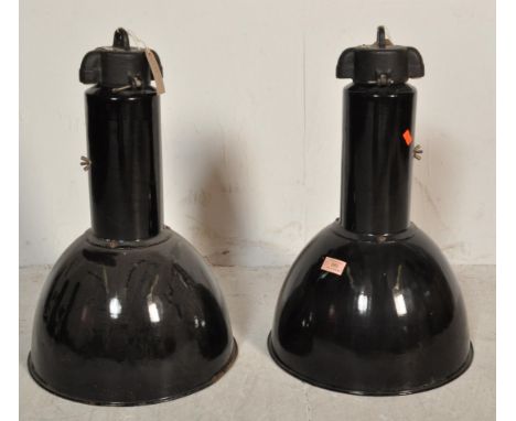 A pair of retro vintage 20th century circa 1960s industrial factory black and white enamel pendant light fittings of conical 