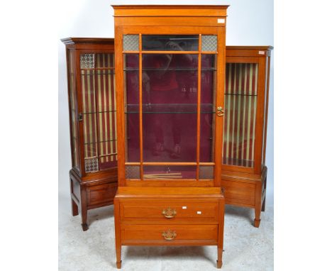 Three early 20th century circa 1900’s - 1920’s shop milleners cabinets / display cabinets. The cabinets of a tall form with s