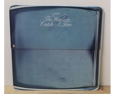 A rare copy of the Wailers ' Catch a Fire ' in the highly sought after and complete ' Zippo ' sleeve - condition looks and ap