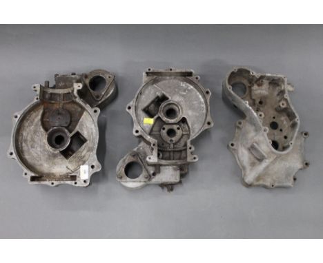 Three vintage motorcycle engine cases, probably from a Velocette, one stamped M-44-5