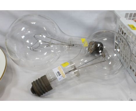Large Osram Eddison screw light bulb +/- 29 cm long, 240V, 1000W and a smaller unmarked light bulb +/- 26 cm long