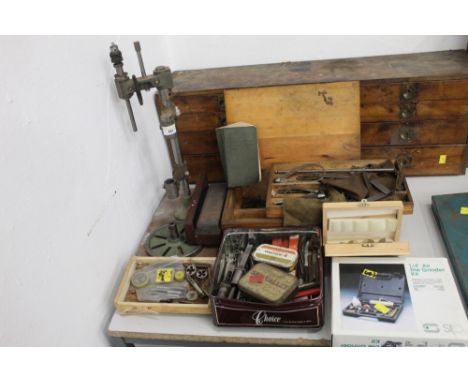A pillar drill stand, together with various boxes containing drill bits, die grinder kit and a box containing a copy of Fowle