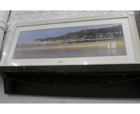 A print of a coastal scene 28 cm x 88 cm, framed and mounted 
