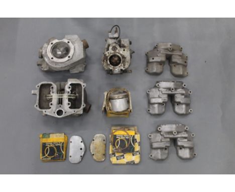Box containing various vintage motorcycle engine parts