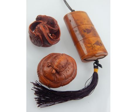 Two fruitwood netsuke, modelled as fish and turtles, together with a three section inro. (3)