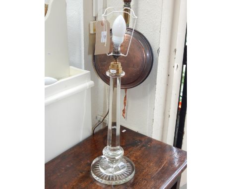 A Victorian style glass table lamp, with octagonal tapered column on a star cut circular base. H. 50cm