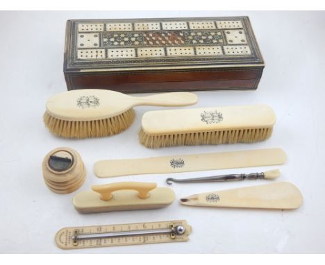 A late Victorian ivory desk thermometer by Gogerty, London together with assorted ivory dressing table items, cribbage box an