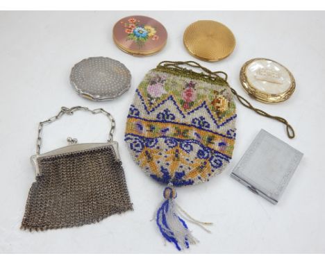 A Victorian polychrome beadwork purse, worked with flower heads, together with a white metal chain purse, a Stratton compact,