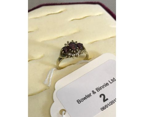 9ct gold ladies ring, set with 3 amethyst stones & CZ sides 