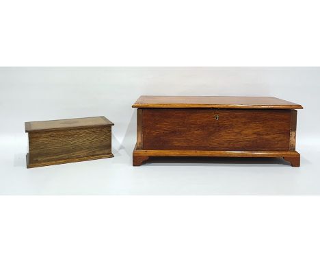 Oak box raised on bracket feet and an oak and inlaid tea caddy (2) 