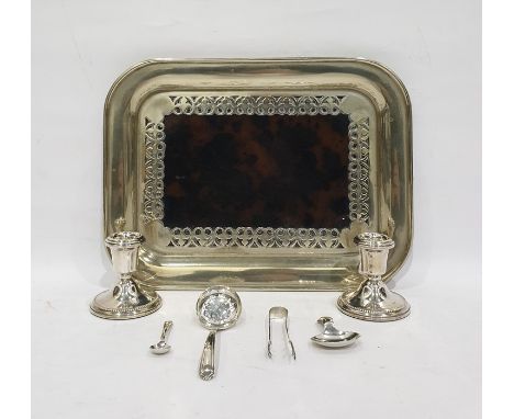 Pair of silver dwarf candlesticks, Sheffield 1980, height 6.5cm, a silver sugar sifter spoon, a pair of sugar nips, a tea cad