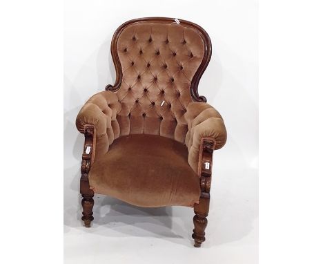 Victorian armchair in brown button-back upholstery, on turned front legs 