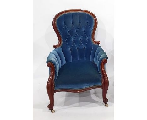 Victorian armchair in blue ground button-back upholstery, serpentine front rail, cabriole supports to white china castors 