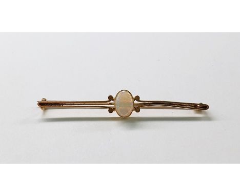 Opal set bar brooch with single oval cabochon stone, on gold-coloured metal mount 