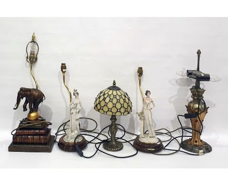 Quantity of table lamps including faux-books on a stand with a resin elephant balancing on a golden ball (33cm high), a 1920'