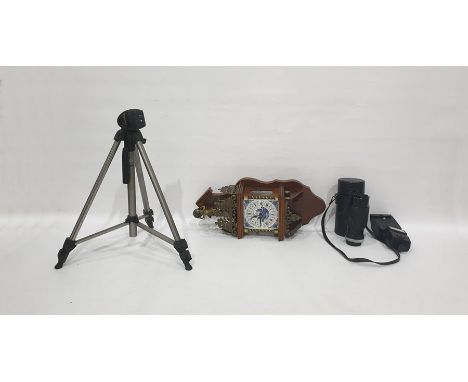 Wall clock with a Delft tile face, brass pediment and assorted camera equipment