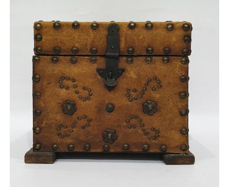 Brown leather and brass studded box opening to reveal assorted magic lantern slides of Victorian and Edwardian scenes and por