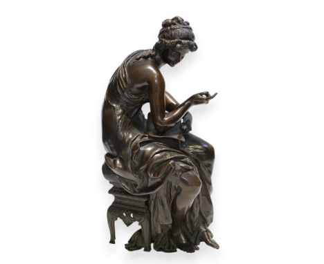 A 19th century French bronze figure of Sappho seated, holding a book and stylus, 34cm high  Even dark chocolate brown patinat