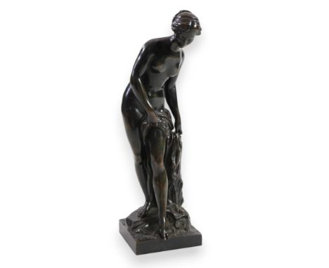 After Étienne-Maurice Falconet (1716-1791), a late 19th century bronze figure of Venus au bain, the nude standing beside a tr