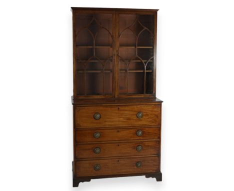 A Regency mahogany secretaire bookcase, the associated top with astragal glazed doors over a fitted fall front drawer and thr