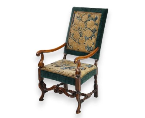 A Louis XV walnut fauteuil tapestry seated armchair with 18th century floral tapestry inset panel upholstery, scroll arms and