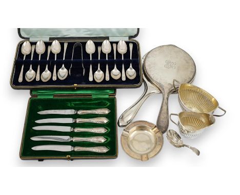 A cased set of twelve George V silver teaspoons with sugar tongs, Sheffield, 1912, two silver hand mirrors, a silver sugar bo
