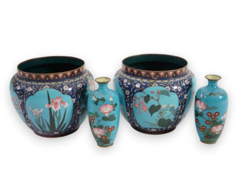A pair of early 20th century Japanese cloisonné jardinieres, decorated with panels of birds and flowers against a pale blue g