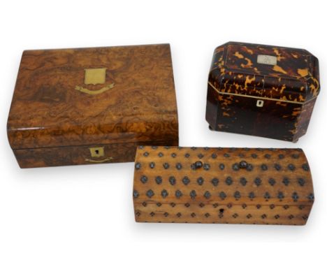 A Regency blond tortoiseshell tea caddy of plain octagonal form, with ivory banded twin compartment interior and silver plate