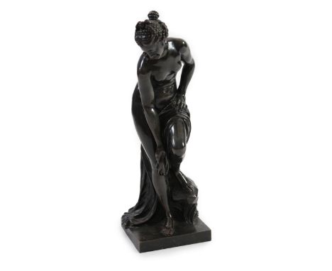 After Christophe-Gabriel Allegrain (1710-1795), a late 19th century bronze model of Venus sortant du bain, standing with her 