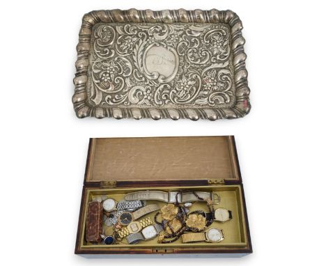 An Edwardian repousse silver dressing table tray, A&amp;J Zimmerman, Birmingham, 1901, 30cm, a silver handled button hook and