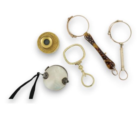 A 19th century mother of pearl and white metal mounted folding double magnifying glass, 40mm, two yellow metal mounted lorgne