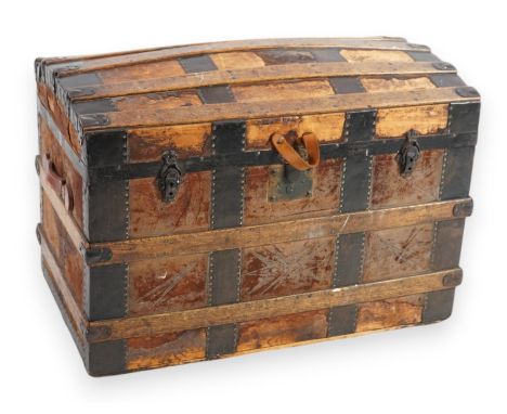 A late Victorian slatted and iron bound leather cover domed top trunk, 88cm wide, 52cm deep, 60cm high  This trunk has seen s